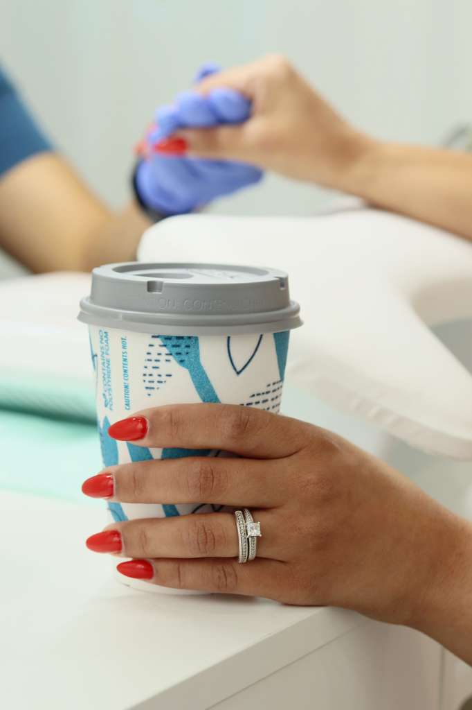 Fresh nails with a coffee cup